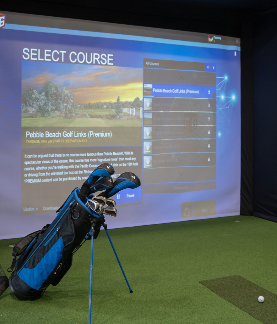 golf bag in front of a golf simulator